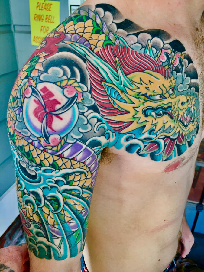 Japanese dragon half sleeve tattoo. By Ezra Bold colorful traditional Japanese half sleeve tattoo angle one
