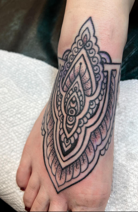 Fine line mandala mendhi art foot tattoo Fine-line Mandala foot tattoo done in the style of traditional Indian mendhi art