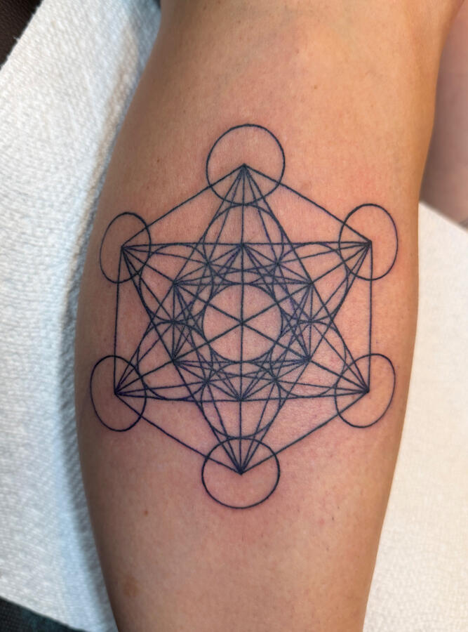 Fine-line sacred geometry tattoo. By Ezra Sacred geometry artwork tattoo done in the fine line tattoo style